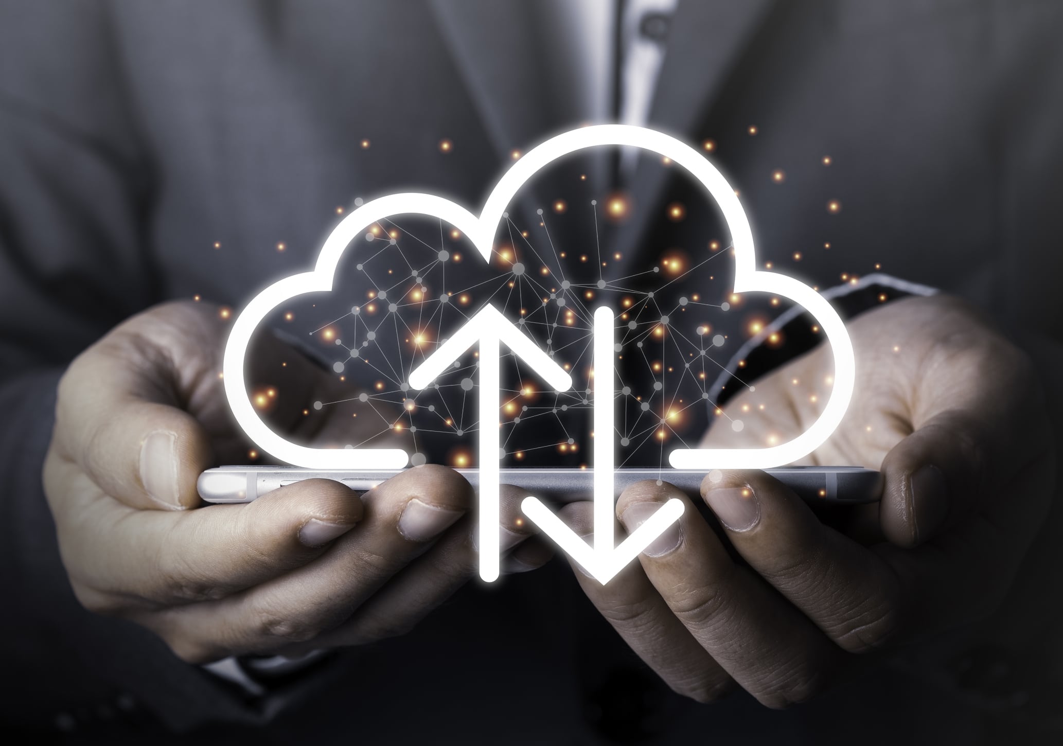 A photo of a laptop and a cloud symbol, representing cloud computing and its impact on business