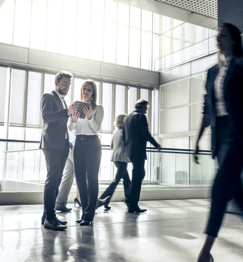 Diverse business team strolling in corporate office setting