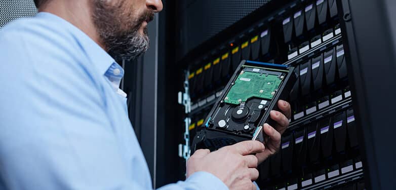 A man looks at the server on a tablet