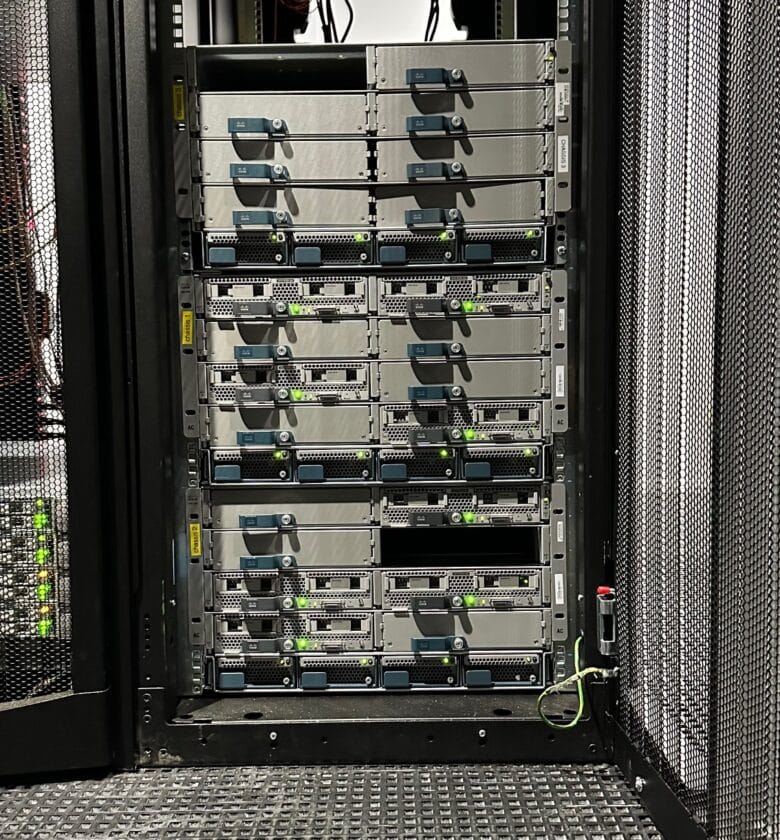 A row of servers in a data center, neatly organized with blinking lights and cables, ready to process and store data efficiently