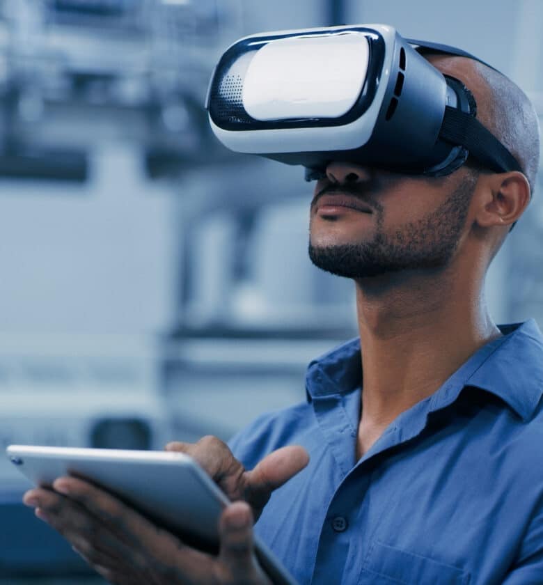 VR, glasses and engineering man on tablet for futuristic research, electronics management or software design. African person or technician in digital, virtual reality and tech in robotics laboratory